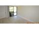 Light-filled room with tile floor and sliding glass doors at 36750 Us Highway 19 N # 23120, Palm Harbor, FL 34684