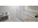 Small kitchen with white cabinets, granite countertops, and appliances at 36750 Us Highway 19 N # 23120, Palm Harbor, FL 34684