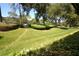 Landscaped yard with lush greenery and manicured lawn at 36750 Us Highway 19 N # 23120, Palm Harbor, FL 34684