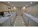 Shared laundry room with multiple washers and dryers at 36750 Us Highway 19 N # 23120, Palm Harbor, FL 34684