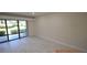 Living room with sliding doors leading to a patio at 36750 Us Highway 19 N # 23120, Palm Harbor, FL 34684