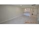 Spacious living area with light tile flooring and access to kitchen at 36750 Us Highway 19 N # 23120, Palm Harbor, FL 34684