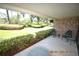 Brick patio with chairs and view of the green space at 36750 Us Highway 19 N # 23120, Palm Harbor, FL 34684