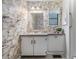 Bathroom with vanity and floral wallpaper at 36905 Beth Ave, Zephyrhills, FL 33542