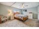 Spacious bedroom with wood bed frame and neutral decor at 36905 Beth Ave, Zephyrhills, FL 33542