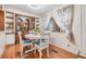 Bright dining area with wood floors and a built-in hutch at 36905 Beth Ave, Zephyrhills, FL 33542