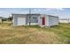 House exterior with shed and grassy yard at 36905 Beth Ave, Zephyrhills, FL 33542
