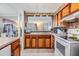 Kitchen with wood cabinets, stainless steel appliances, and breakfast bar at 36905 Beth Ave, Zephyrhills, FL 33542