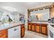 Kitchen with wood cabinets, stainless steel appliances, and breakfast bar at 36905 Beth Ave, Zephyrhills, FL 33542