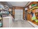 Laundry room with washer, dryer, and shelves at 36905 Beth Ave, Zephyrhills, FL 33542