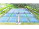 Aerial view of multiple well-maintained pickleball and tennis courts at 36905 Beth Ave, Zephyrhills, FL 33542