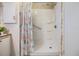 Walk-in shower with flamingo shower curtain at 36905 Beth Ave, Zephyrhills, FL 33542