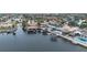 Wide aerial view of canal front homes with private docks and lush landscaping at 3734 Topsail Trl, New Port Richey, FL 34652