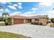 House exterior with attached garage and driveway at 3734 Topsail Trl, New Port Richey, FL 34652