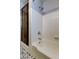 Bathroom with shower/tub combo and patterned tile floor at 4059 Benson N Ave, St Petersburg, FL 33713