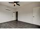 Spacious bedroom with dark tile floors and ceiling fan at 4059 Benson N Ave, St Petersburg, FL 33713