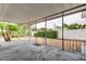 Covered patio with concrete flooring and metal railings at 4059 Benson N Ave, St Petersburg, FL 33713