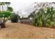 Landscaped side yard with gravel and tropical plants at 4059 Benson N Ave, St Petersburg, FL 33713