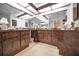 Bathroom with dark brown vanity and a window to a garden at 419 Wayfarer Ct, Tarpon Springs, FL 34689