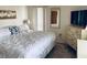 King-size bed, dresser and large window in this bedroom at 4352 Tahitian Gardens Cir # E, Holiday, FL 34691