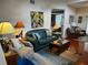 Living room with green couch, coffee table, and armchairs at 458 Grant St, Dunedin, FL 34698