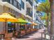 Restaurant patio with colorful umbrellas and seating at 458 Grant St, Dunedin, FL 34698