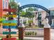 Welcome to Dunedin, Florida! This sign points the way to waterfront shops, restaurants, and more at 458 Grant St, Dunedin, FL 34698