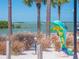 Scenic waterfront view with a colorful dolphin statue at 458 Grant St, Dunedin, FL 34698