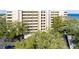 Aerial view showing condo building, landscaping, and a car in the parking lot at 5020 Bayshore Blvd # 403, Tampa, FL 33611