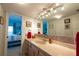 Bathroom with double vanity and view into bedroom at 5020 Bayshore Blvd # 403, Tampa, FL 33611