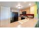 Condo kitchen with light wood cabinets and black appliances at 5020 Bayshore Blvd # 403, Tampa, FL 33611