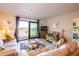 Spacious living room featuring water views and access to balcony at 5020 Bayshore Blvd # 403, Tampa, FL 33611