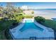 Community pool with a waterfront view and lounge chairs at 5020 Bayshore Blvd # 403, Tampa, FL 33611