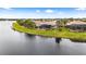 Aerial view showcasing home's location by the lake at 5040 Ruby Flats Dr, Wimauma, FL 33598