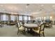 Elegant clubhouse card room with ample seating and large tables at 5040 Ruby Flats Dr, Wimauma, FL 33598