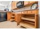 Well-organized kitchen with ample storage in wooden cabinets at 5040 Ruby Flats Dr, Wimauma, FL 33598