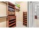 Large walk-in closet with shelving and drawer space at 5040 Ruby Flats Dr, Wimauma, FL 33598