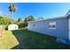 Side view of the house showcasing its light gray exterior at 5109 Eldorado Dr, Tampa, FL 33615