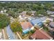 Aerial view of a house with a pool and surrounding neighborhood at 630 Bayside Dr, Tarpon Springs, FL 34689