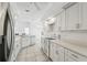 Modern kitchen with white cabinets and granite countertops at 630 Bayside Dr, Tarpon Springs, FL 34689