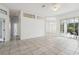 Spacious living room with tile floors and access to other rooms at 630 Bayside Dr, Tarpon Springs, FL 34689