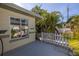 Front yard with white picket fence and palm trees at 6390 115Th Ln, Seminole, FL 33772