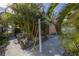 Side yard with clothesline and shed visible at 6390 115Th Ln, Seminole, FL 33772