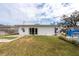 Backyard view of the house, showing patio and pool at 6500 Dr Martin Luther King Jr N St, St Petersburg, FL 33702