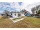 Backyard with putting green, pool, and patio furniture at 6500 Dr Martin Luther King Jr N St, St Petersburg, FL 33702