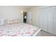 Bedroom with flamingo bedding and built-in closet at 6500 Dr Martin Luther King Jr N St, St Petersburg, FL 33702