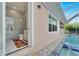 Convenient poolside bathroom with marble finishes at 705 Pinckney Dr, Apollo Beach, FL 33572