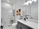 Clean bathroom with walk-in shower and gray vanity at 705 Pinckney Dr, Apollo Beach, FL 33572