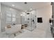 Spa-like bathroom with a large soaking tub and walk-in shower at 705 Pinckney Dr, Apollo Beach, FL 33572