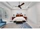 Bright bedroom with a king-size bed and ample natural light at 705 Pinckney Dr, Apollo Beach, FL 33572